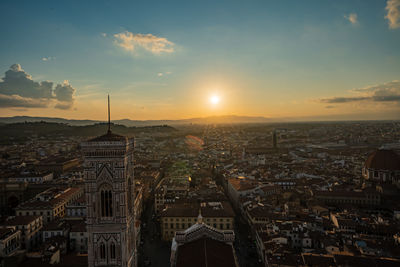 High angle view of city buildings during sunset