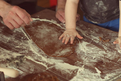 Midsection of person preparing food on table