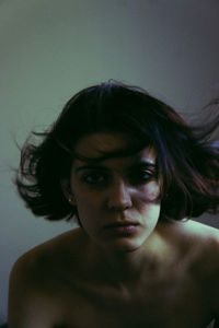 Close-up portrait of a serious young woman