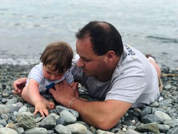 Father with son  on shore at beach