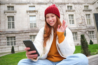 Young woman using mobile phone