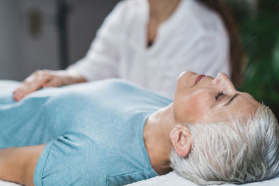 Close-up of woman getting massage at spa