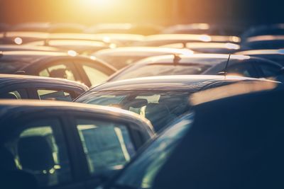 Close-up of cars during sunset