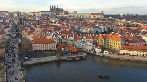 High angle view of river amidst buildings in city