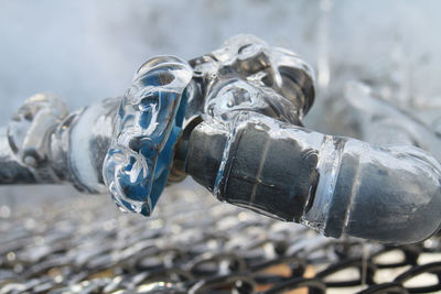 Close-up of frozen metallic pipe