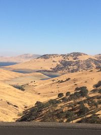 Scenic view of landscape against clear blue sky