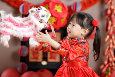 Young chinese girl with traditional dressing up celebrate chinese new year