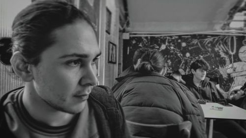 Portrait of young man looking away