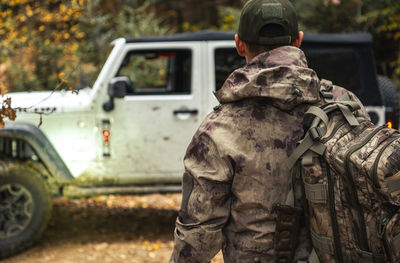 Low angle view of soldiers standing in car