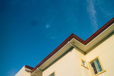 Low angle view of building against blue sky