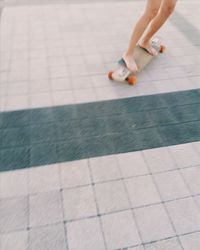 Low section of woman on floor