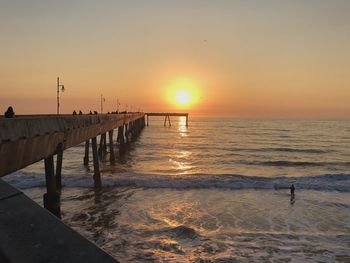Ocean pier with sunset
