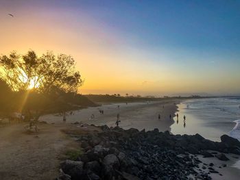 Scenic view of sea against clear sky during sunset