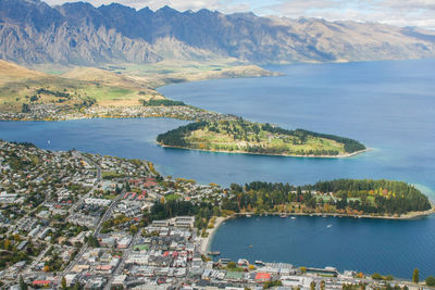 High angle view of sea by city