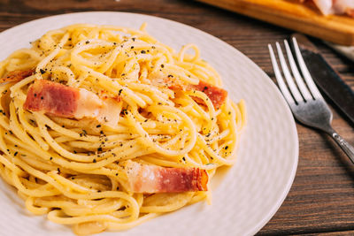 Close-up of noodles in plate on table