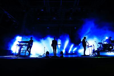Silhouette of people at night
