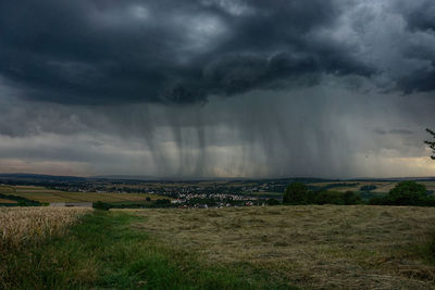 Storm clouds over field