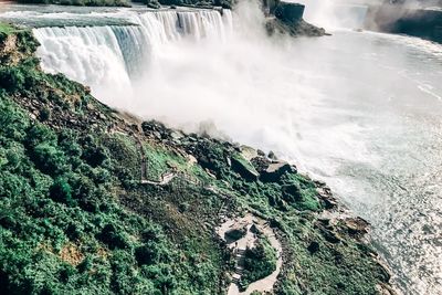 Panoramic view of waterfall against sky