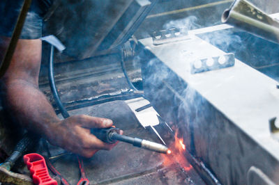 Man working on metal