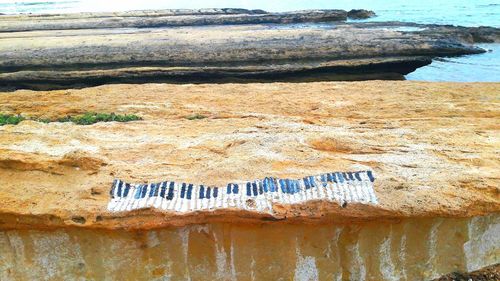 High angle view of rock formation on beach