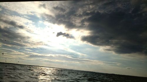 Scenic view of sea against sky at sunset