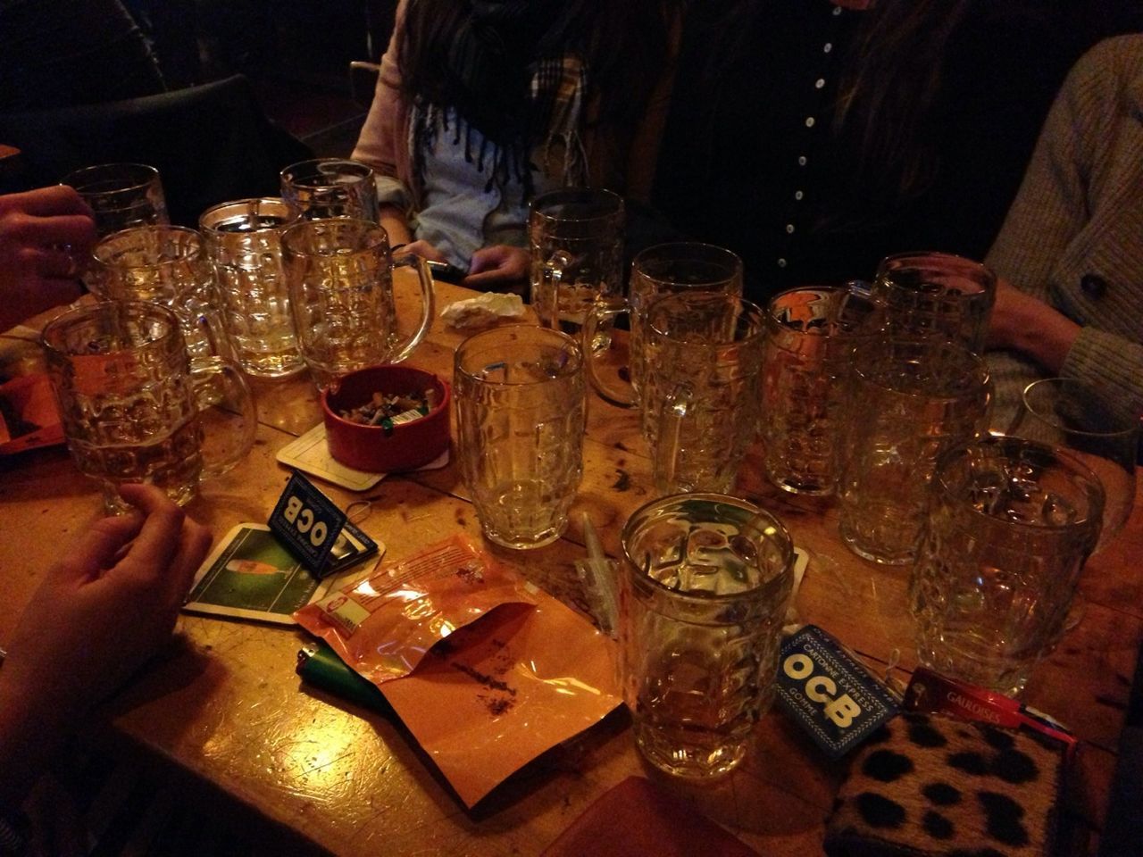 indoors, food and drink, table, still life, high angle view, drink, close-up, person, variation, part of, large group of objects, refreshment, illuminated, food, drinking glass, bottle, choice