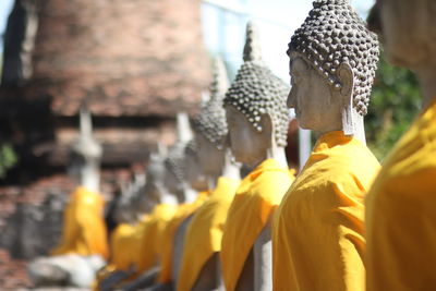 Statue of buddha against building