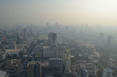 High angle view of modern buildings in city against sky