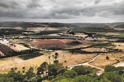 Aerial view of landscape against cloudy sky