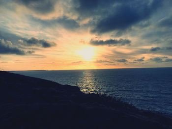 Scenic view of sea against sky during sunset