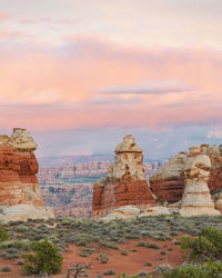 Pink sky sunset over the doll house in the maze of canyonlands utah