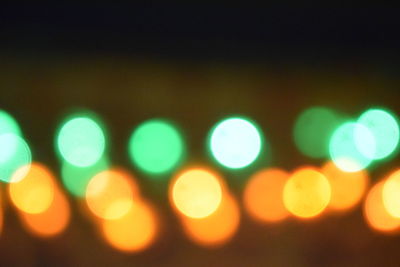 Defocused image of illuminated lights at night