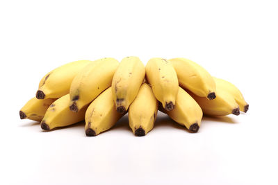 Close-up of yellow slices over white background