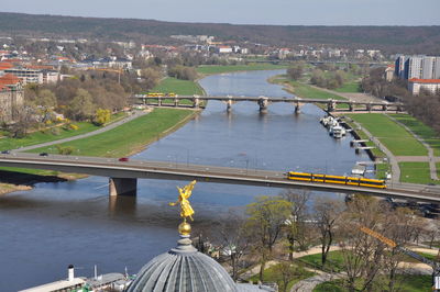 High angle view of bridge over river by buildings