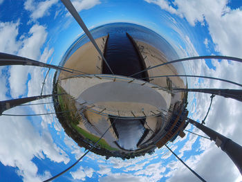 Low angle view of ferris wheel against sky