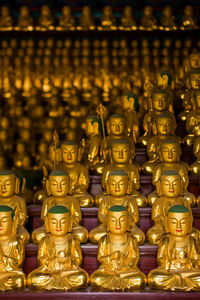 Golden buddha statues at a buddhist temple