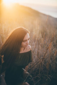 Close-up of young woman in grass