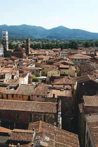 Cityscape with mountain range in background