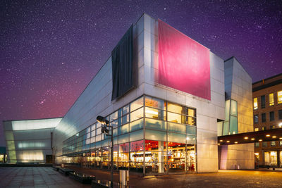 Low angle view of building against sky at night