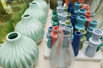 High angle view of multi colored bottles on table