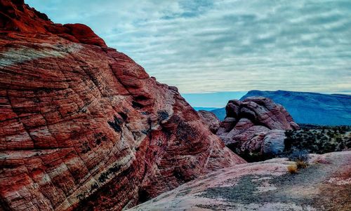 Rock formation on land against sky