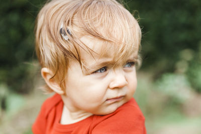 Close-up of cute boy looking away