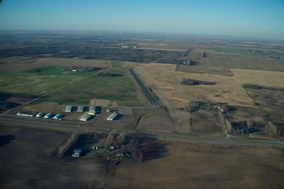 Aerial view of agricultural field against sky