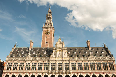 Low angle view of historic building against cloudy sky