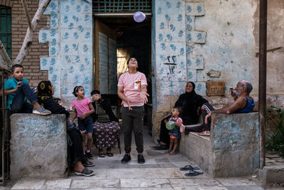 Group of people in front of building