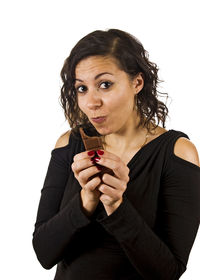 Close-up portrait of young woman against white background