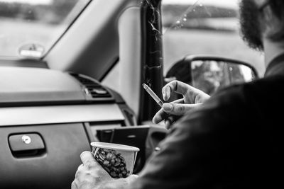 Close-up of man driving car