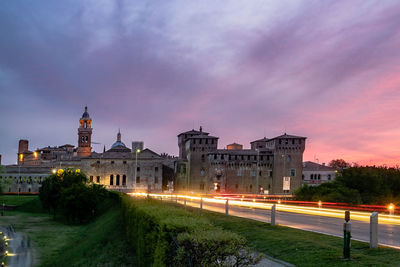 Buildings in city at sunset