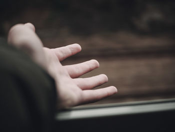 Close-up of man  hand in a train