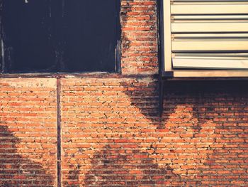 Window on brick wall of building